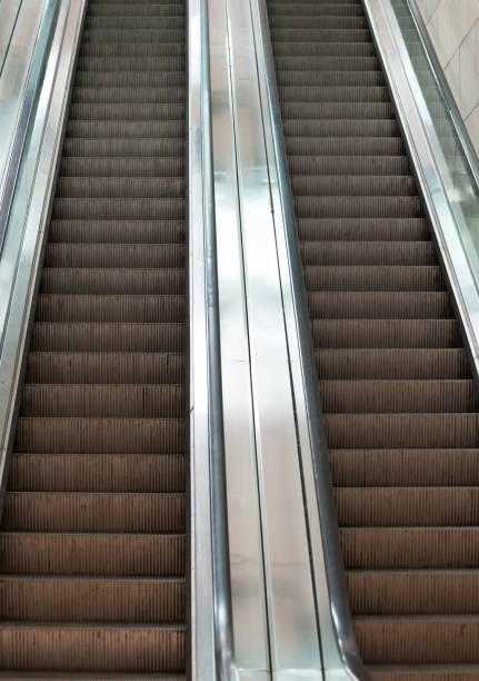 istock Electric escalator in metro. Moving staircase. 875945094