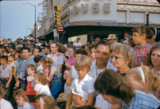 San Antonio, Texas, USA, 1960. Fiesta Parade in San Antonio. The citizens of San Antonio and the surrounding area watch the parade from the roadside.