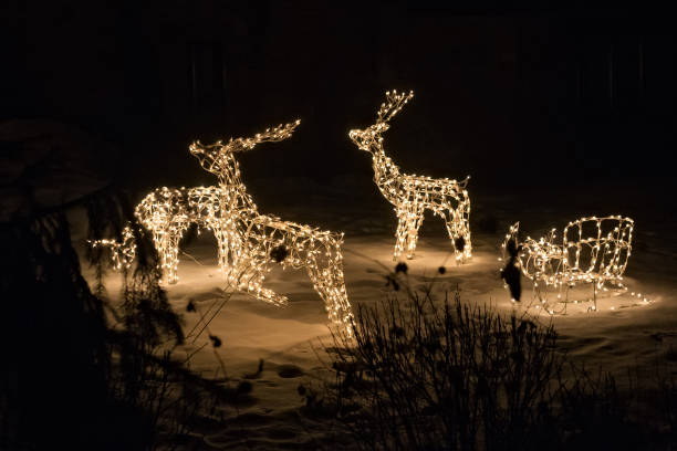 istock Electric sculptures of deers. 875952020