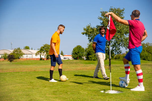 istock Footgolf Players with Their Coach 875952130