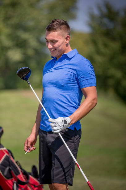 istock Young Adult Holding Golf Club 875952176