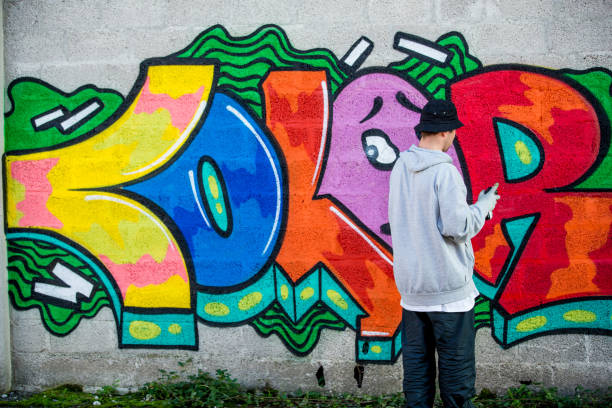istock Graffiti Artist In Front of His Graffiti 875952476