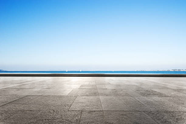 istock empty marble floor with blue sea in blue sky 875956580