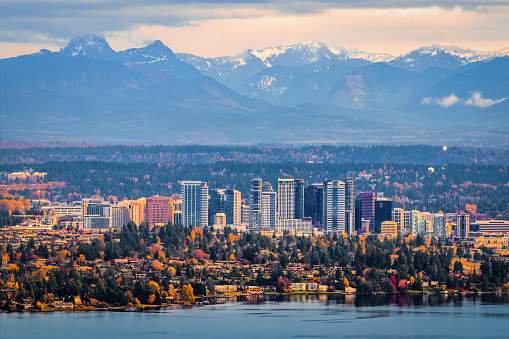 Bellevue, Washington. The snowy Alpine Lakes Wilderness mountain peaks rise behind the urban skyline.