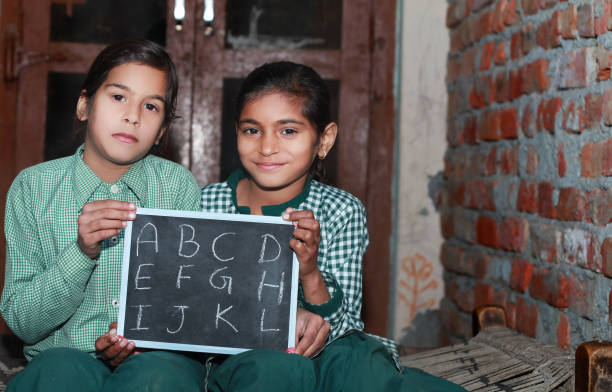 istock Two Little Girl Portrait with chalkboard 875961158