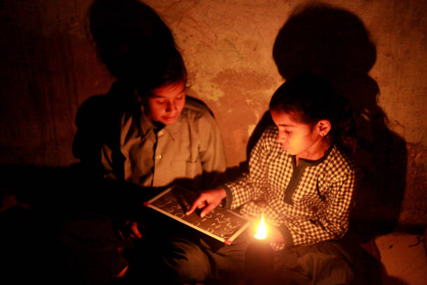 istock Poor little girls studying at home 875961194