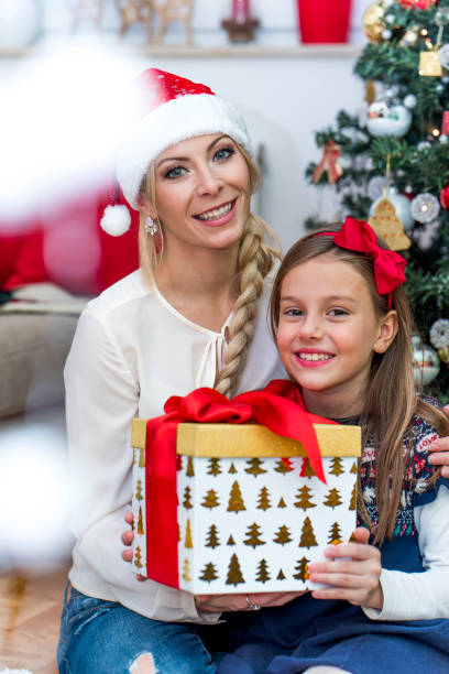 istock Mother and daughter on Christmas 875969902