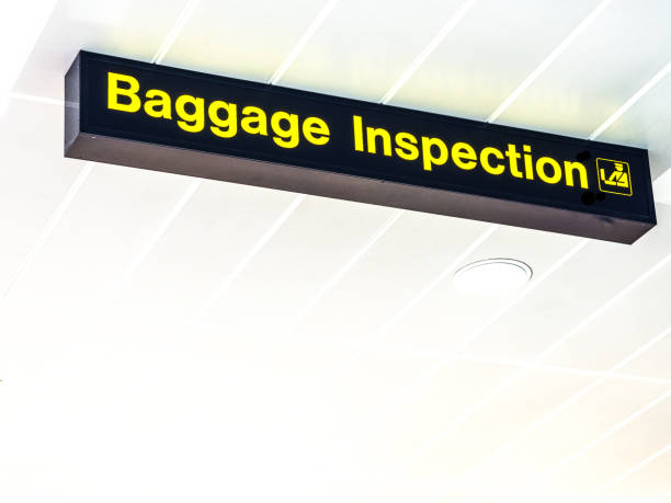 istock Baggage Inspection airport sign 875976906