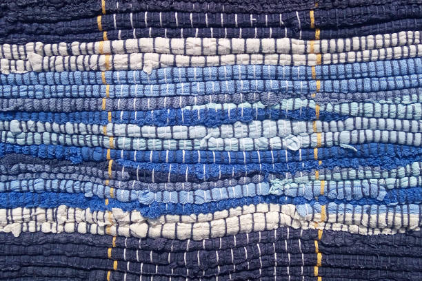 Cloth sewn from strips of fabric. Needlework, reuse of materials. Textile background.