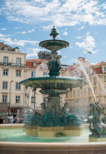 istock Fountain in Rossio square at Lisbon. 875980750