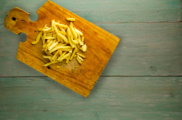 istock fry potatoes on a wooden background 875983440