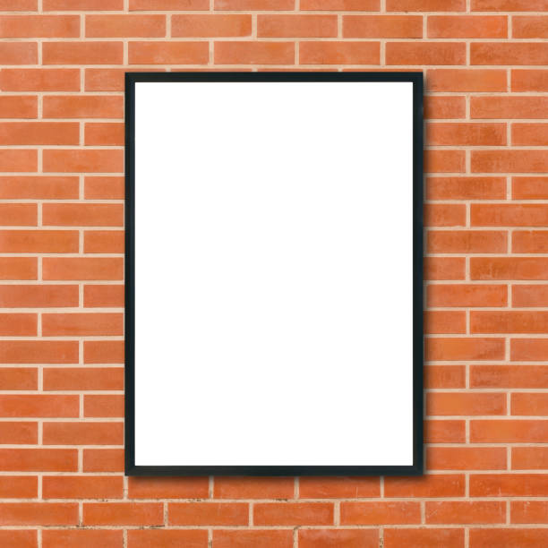 istock Mock up blank poster picture frame hanging on red brick wall background in room - can be used mock up for montage products display and design key visual layout. Mock up poster in interior background. 875985546