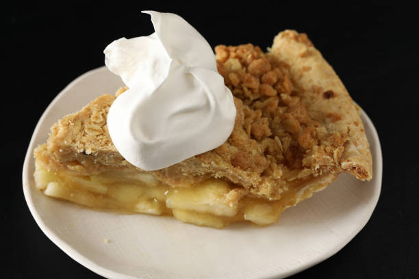 istock Slice Of Apple Pie With Cream 875987410