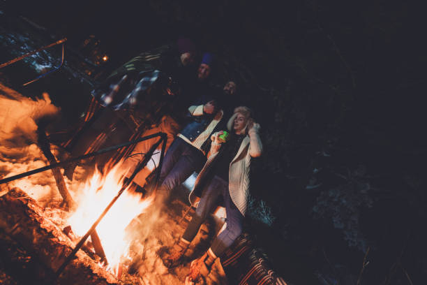 istock Friends camping on snowy mountain 875991750