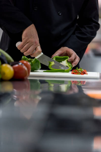 istock Unrecognizable chef chopping vegetables to prepare a dish 875991864