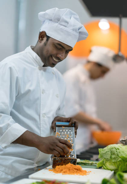 istock Chef's preparing food at a restaurant looking very happy 875991958