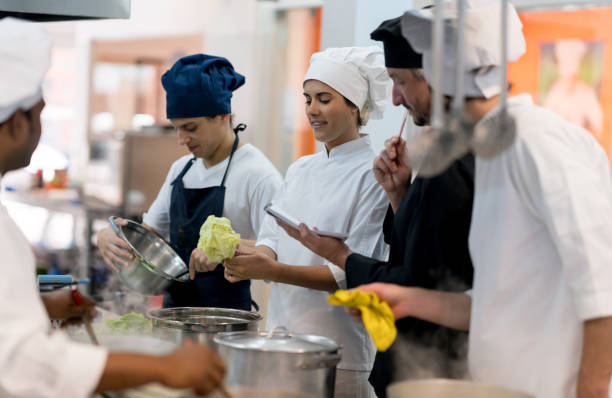 istock Chef making a list of the ingredients that need to be bought and asking his team 875992036