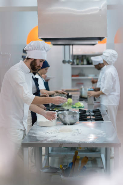istock Chef making pizza dough at an italian restaurant 875992076