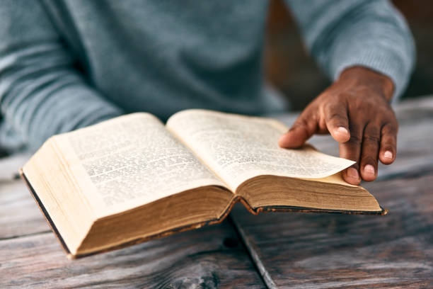 I just have to go back to the previous page Cropped shot of an unrecognizable man reading a book gospel stock pictures, royalty-free photos & images