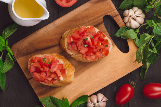 istock Appetizer bruschetta with tomatoes, olives and herbs. Italian cuisine 875999710