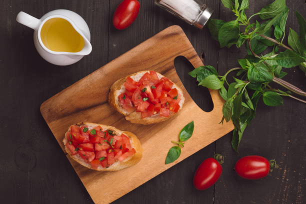 istock Appetizer bruschetta with tomatoes, olives and herbs. Italian cuisine 875999724