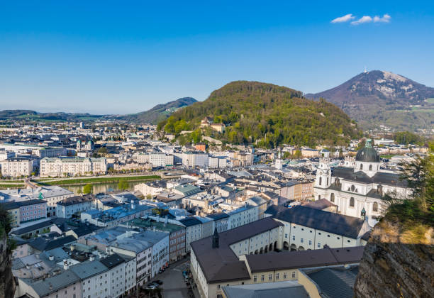 istock Salzburg Village Rooftops on Hills Background 876000138