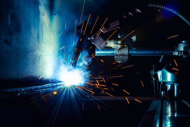 istock Flux Cored Arc Welding semi automation machine weld inside steel structure weld repair in fabrication factory. 876000984