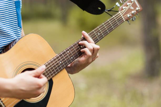 istock Musician lifestyle guitar nature concept. 876011284