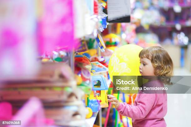 Toddler Kid Shopper At The Toy Shop Stock Photo - Download Image Now - Toy, Store, Child