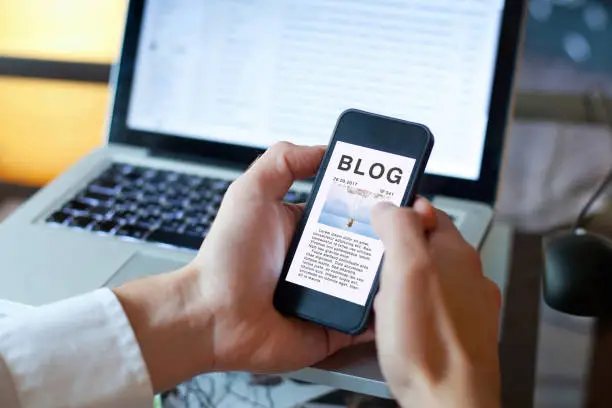 blog, person reading blogger article on the screen of smart phone mobile