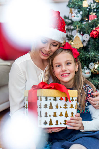 istock Mother and daughter on Christmas 876014608