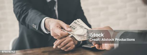 Businessman Accepting Japanese Yen Money Stock Photo - Download Image Now - Debt, Japanese Currency, Currency