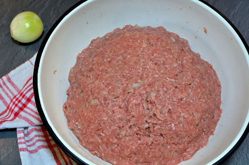 Minced meat in a bowl. Stages of preparation of minced meat for steam cutlets. Series.