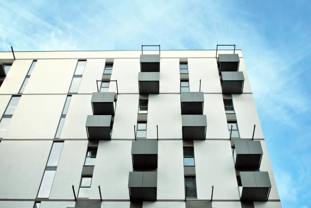 istock Modern apartment buildings on a sunny day with a blue sky. 876019344