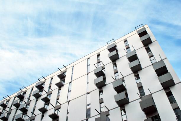 istock Modern apartment buildings on a sunny day with a blue sky. 876020124