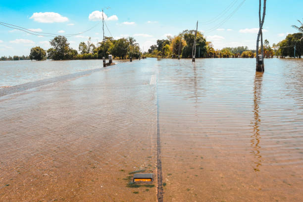 istock The floods flow through the concrete road. 876025756