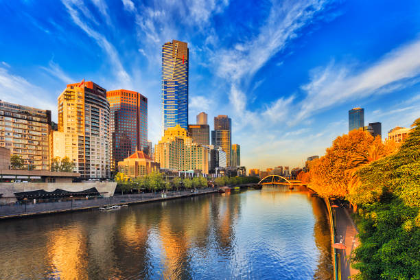 Me S Yarra Eureka Morning Tallest Melbourne skyscraper Eureka tower dominates South Yarra cityscape over Yarra river in warm morning sunlight under blue sky. south yarra stock pictures, royalty-free photos & images