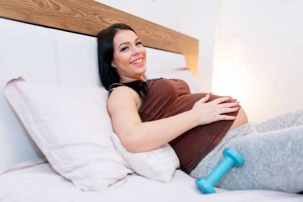 istock Fatigued pregnant woman resting after exercising 876029596