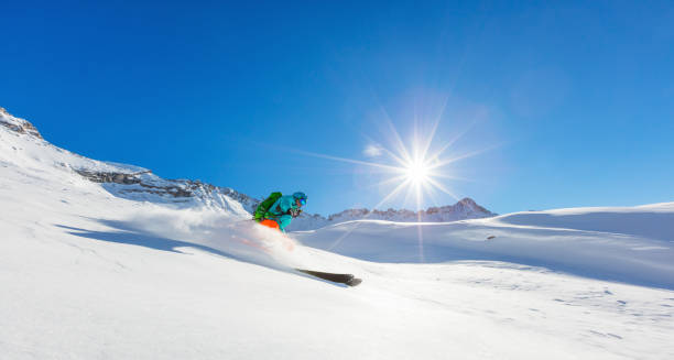 istock Freerider skier running downhill 876034188
