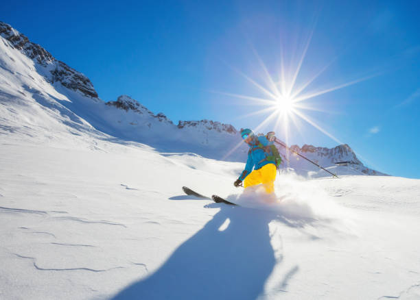 istock Freerider skier running downhill 876034240
