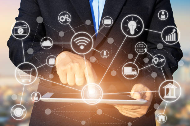 istock business technology concept, Business people hands use tablet connection online networking communication on smartphone with social network icon symbol, selective focus. 876041104