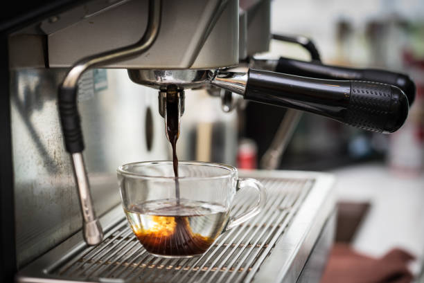 istock Coffee espresso machine making Americano in cafe at morning. 876041422