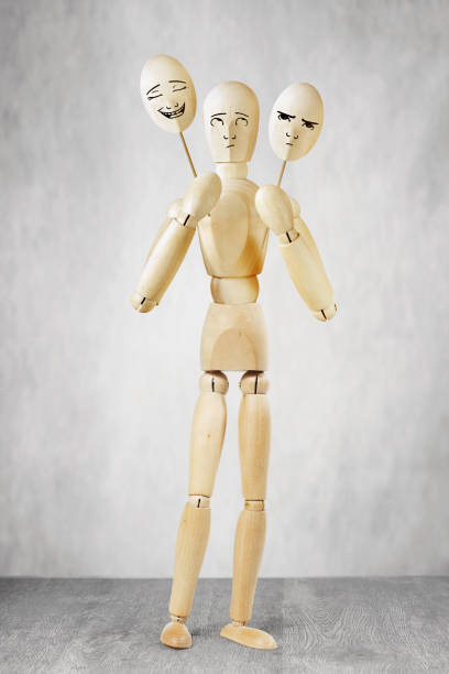 istock Man on stage chooses a cheerful and sad mask 876042378