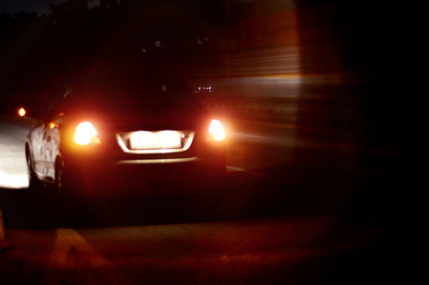 istock Rear view of car at night 876049016