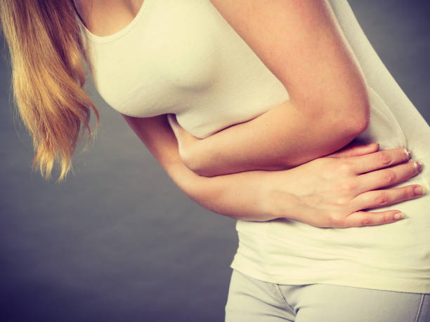 istock Woman suffer from belly pain. 876055836