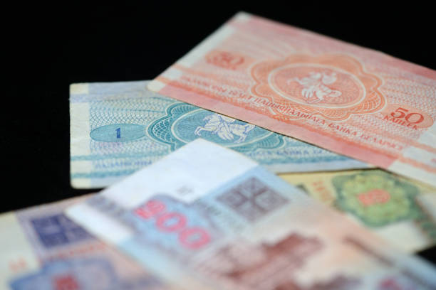 istock Obsolete Belarusian banknotes on a dark background close up 876060404