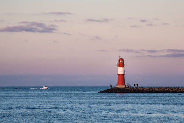 istock Mole on the Baltic Sea coast in Warnemuende, Germany 876060560