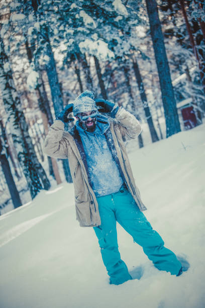 istock Hipster man on snowy mountain 876062794