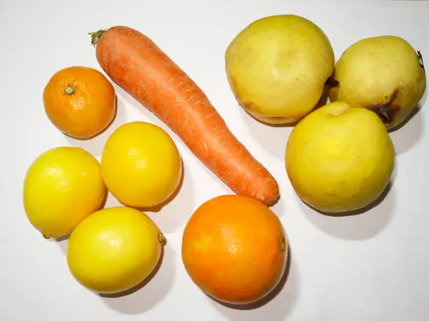 Carrot on a white background,lemon,quince,and orange