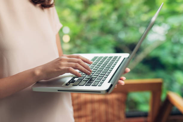 istock Woman working at home office hand on keyboard close up 876067898
